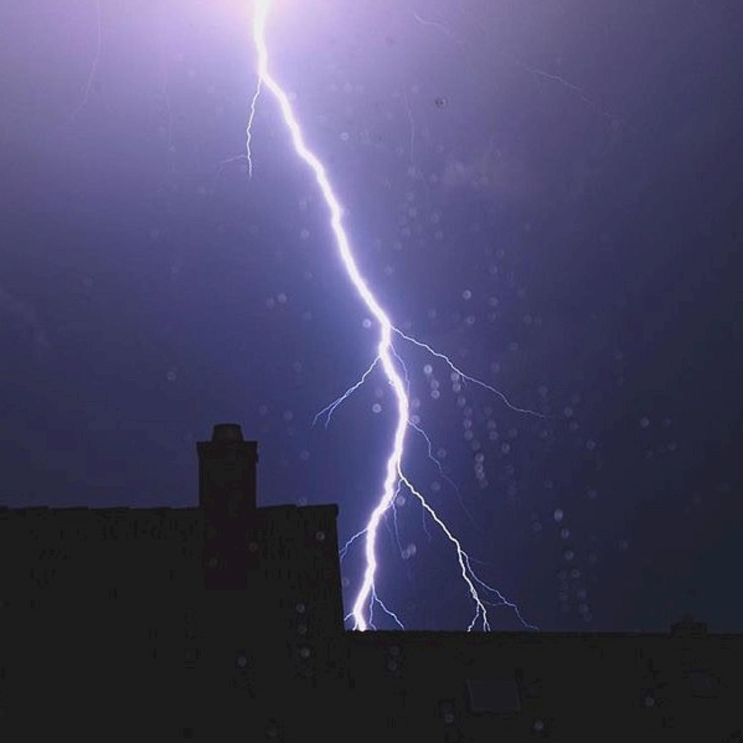 Thunder and Rain Dancing Off The Beach House