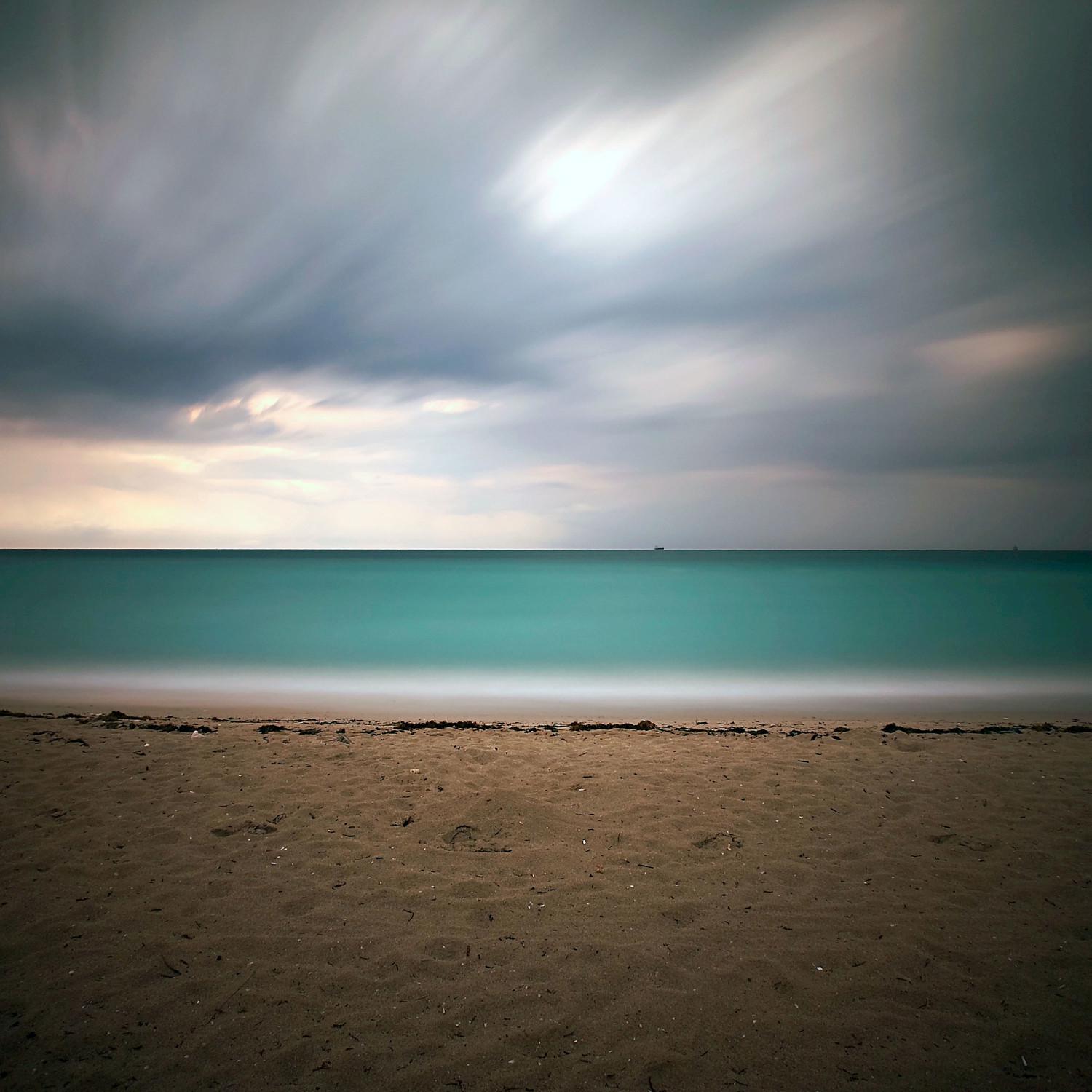 Calm Waves On a Sandy Beach